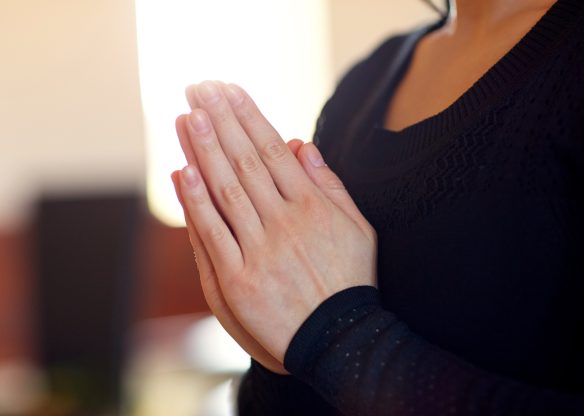 close up of sad woman praying god in church close up of sad woman praying god in church